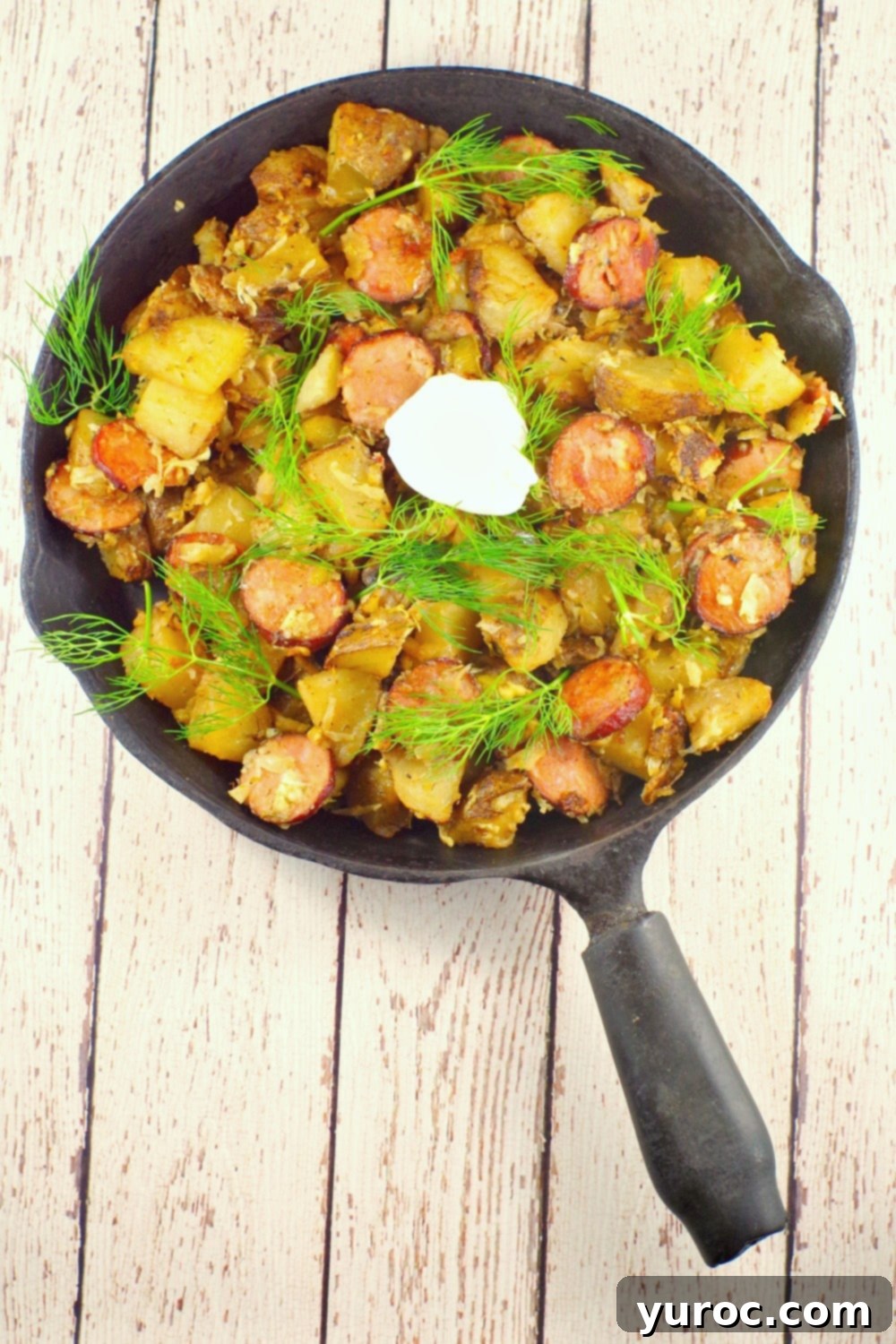 This easy Ukrainian recipe uses home made hash browns that can be made with fresh or leftover baked potatoes, dill, Ukrainian sausage, dry cottage cheese and sauerkraut for an easy and quick breakfast that's the perfect brunch potluck idea.