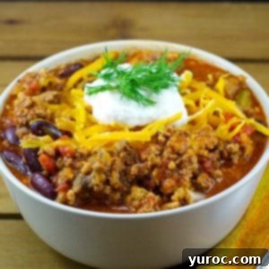 chili in a bowl on a wooden surface