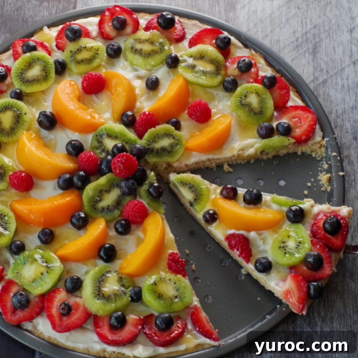 Effortless Mixed Bean Salad 8 fruit pizza with a slice being lifted out