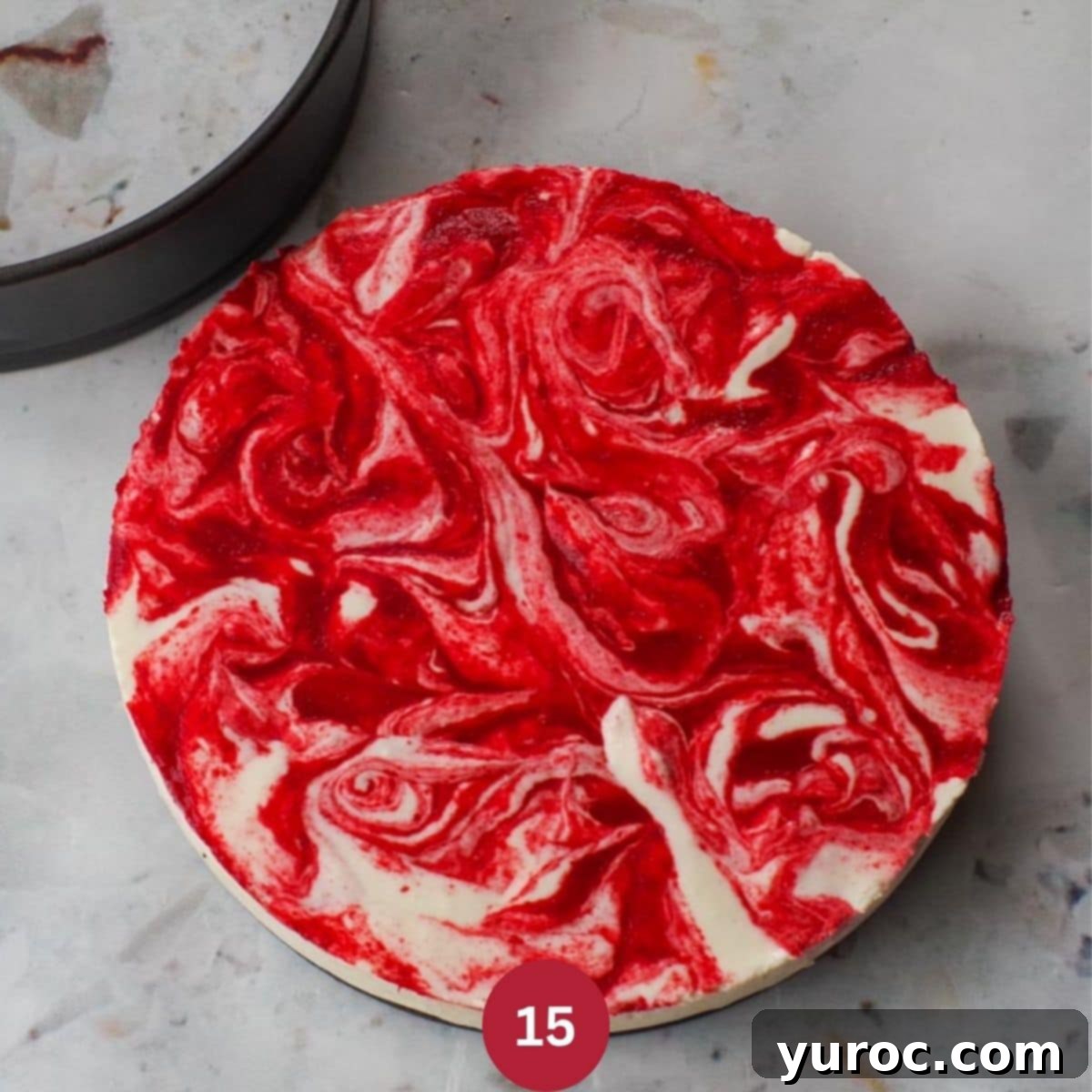 A beautifully presented whole No Bake Strawberry Rhubarb Cheesecake.
