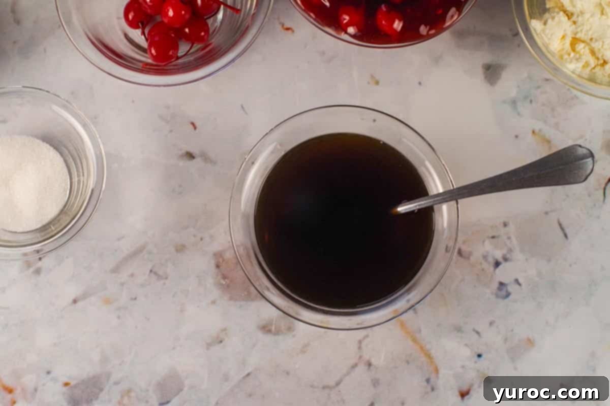 Coffee and Kahlua mixed together in a small glass bowl.