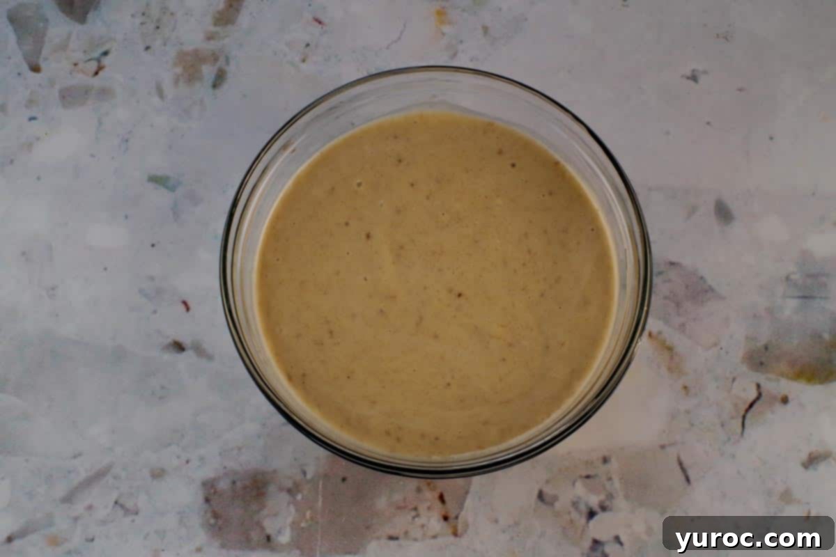 Blended nice cream mixture poured into a loaf pan, ready for freezing.