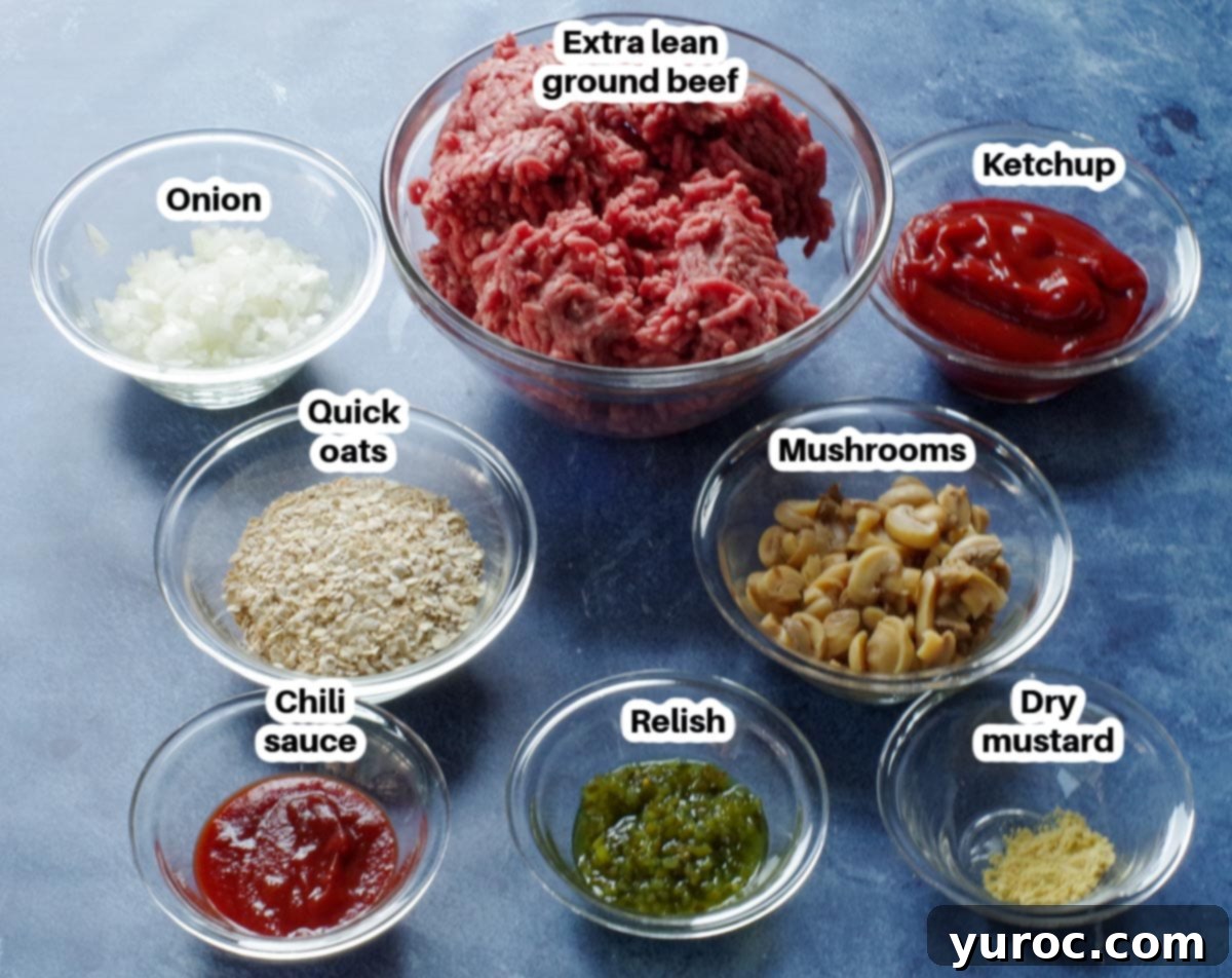 Old fashioned meatloaf ingredients in glass bowls, labelled, on blue surface