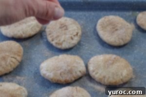 cinnamon sugar being sprinkled on pita bread
