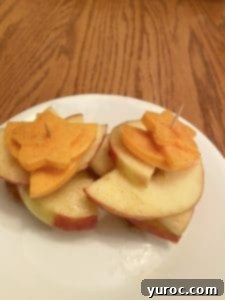 caramel apple cheddar bites on a white plate after being cut 24 hours ago