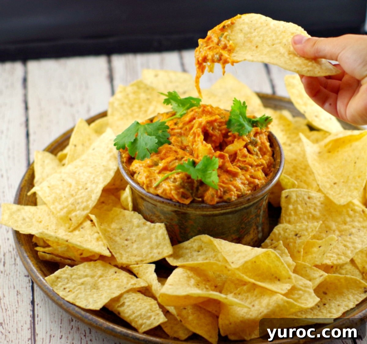 Baked healthy artichoke dip | game day food - Foodmeanderings.com - A close-up of the delicious dip ready to serve.
