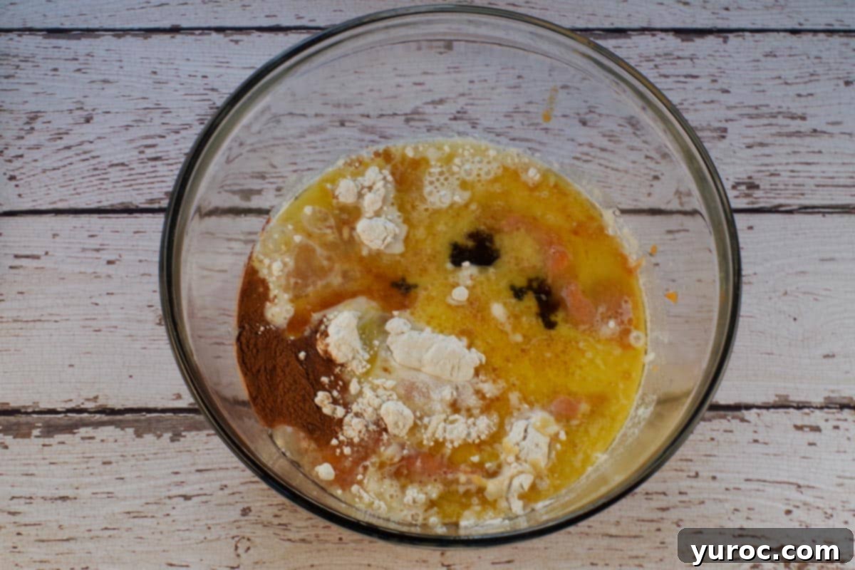 Toasted Marshmallow Sweet Potato Delight 5 Sweet potato filling ingredients in a large glass bowl.