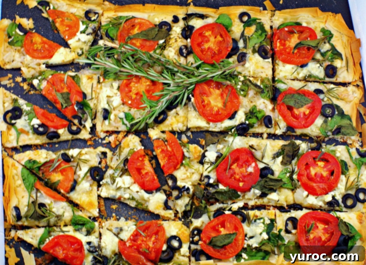 Greek Phyllo Vegetable Tart 6 Close up of a Greek Phyllo Pizza sliced into triangles