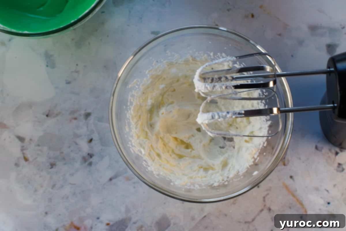 St. Patrick's Day Shamrock Irish Cream Shots 11 Remaining whipped cream (for garnish) in glass bowl, with beaters over top of bowl.