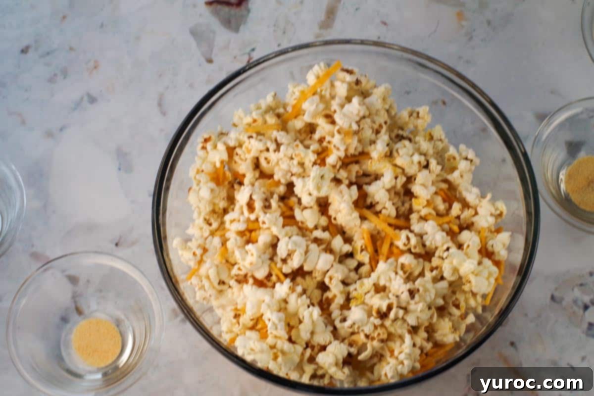 Popcorn mixed with hickory sticks in a large bowl.