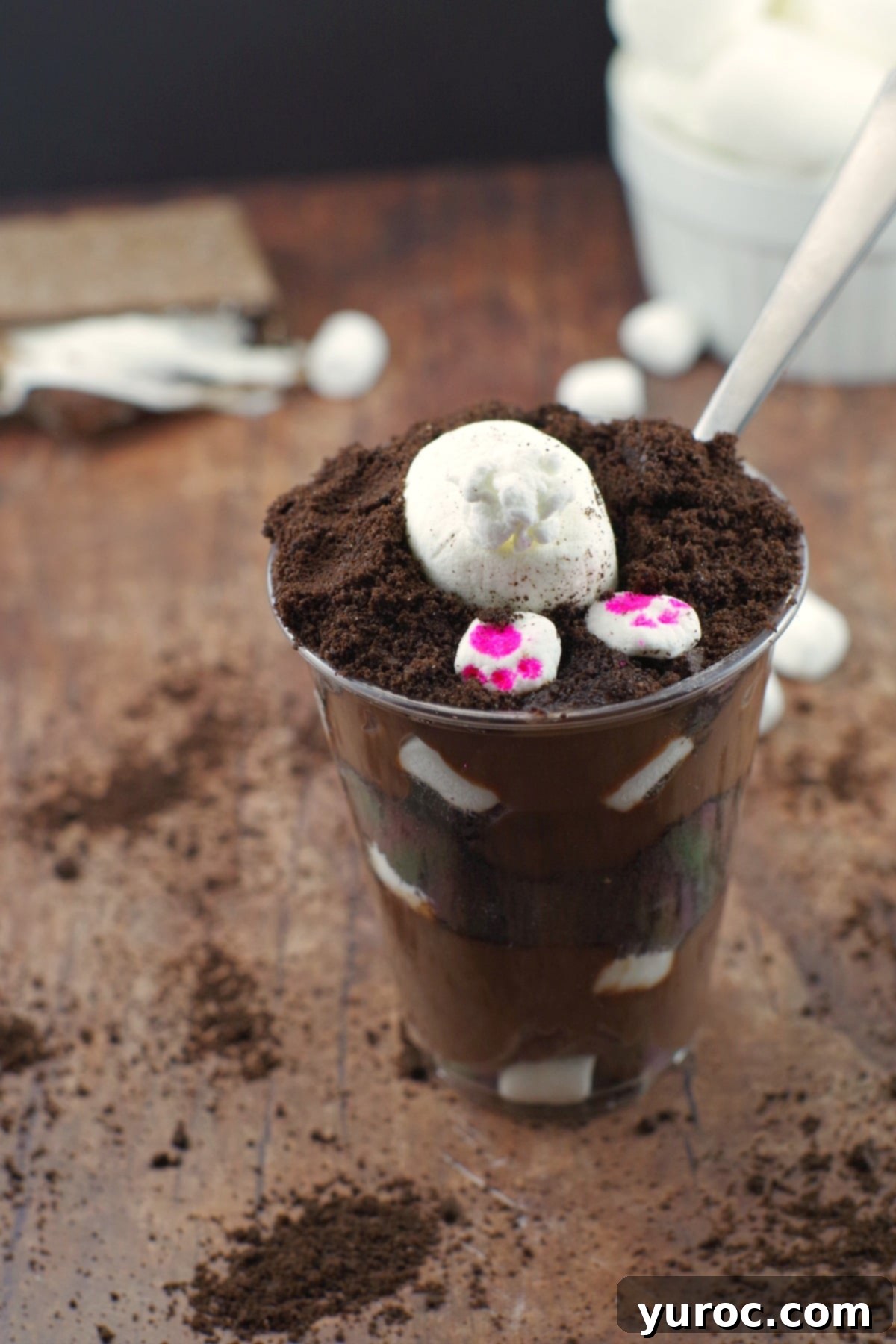 Close-up of an Easter Bunny Dirt Cup, showcasing the delicious layers and cute marshmallow bunny butt and paws.