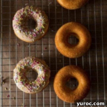 Five perfectly crafted Baileys donuts arranged on a wire cooling rack, ready to be enjoyed as a sweet treat.
