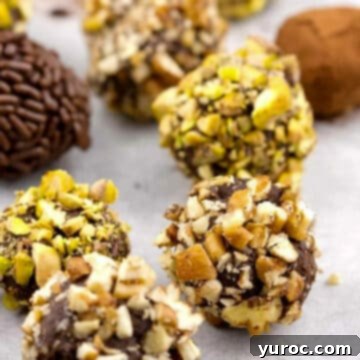 Exquisitely presented Baileys Irish Cream Chocolate Truffles arranged neatly on a pristine white surface, highlighting their rich appearance and inviting texture.