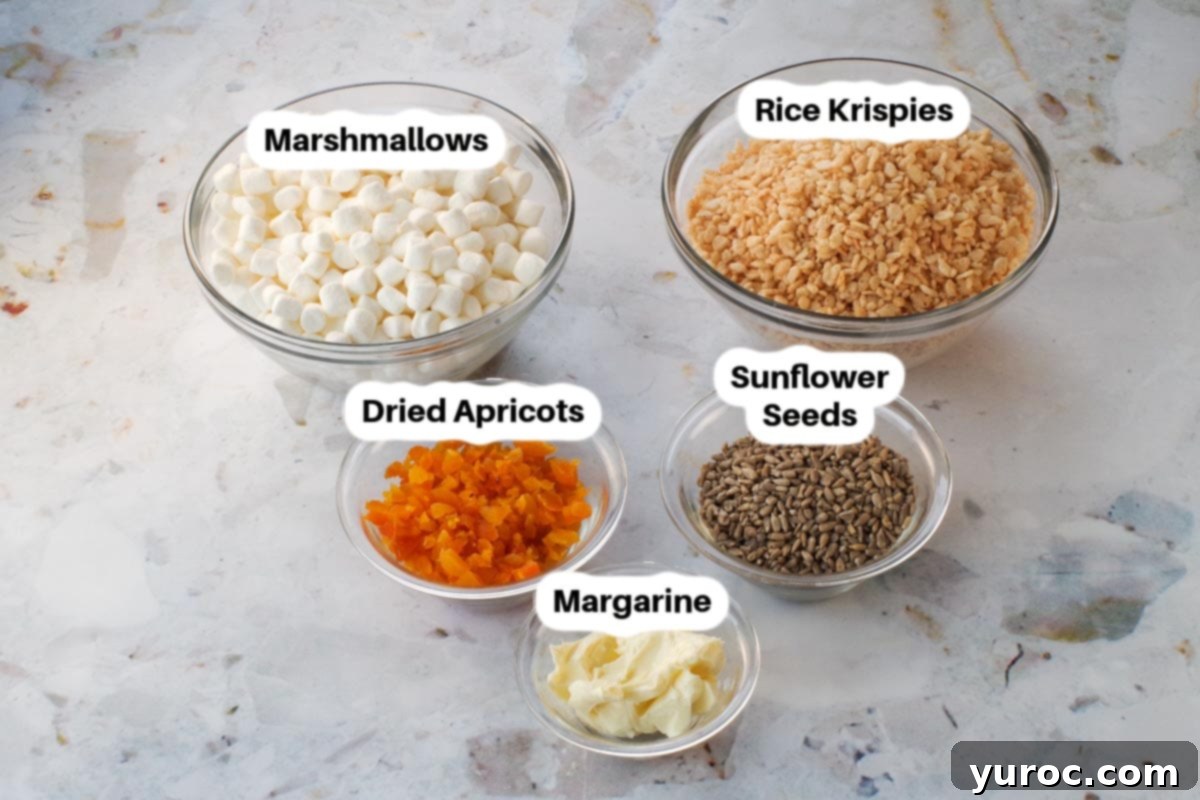 Ingredients in Healthy Rice Krispie Treats in glass bowls, labelled.