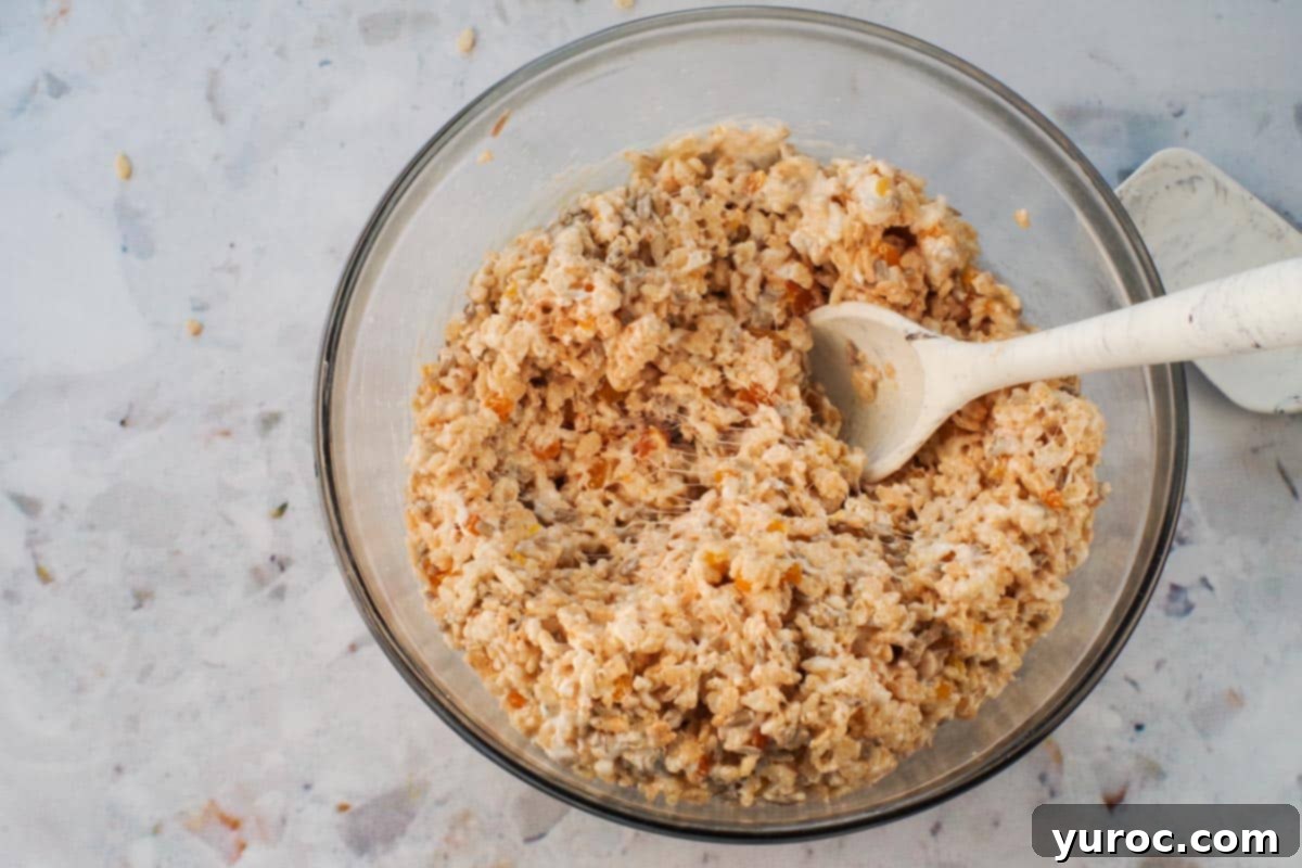 Rice krispies, chopped apricots and suflower seeds added to the large glass bowl with margarine and marshmallows.