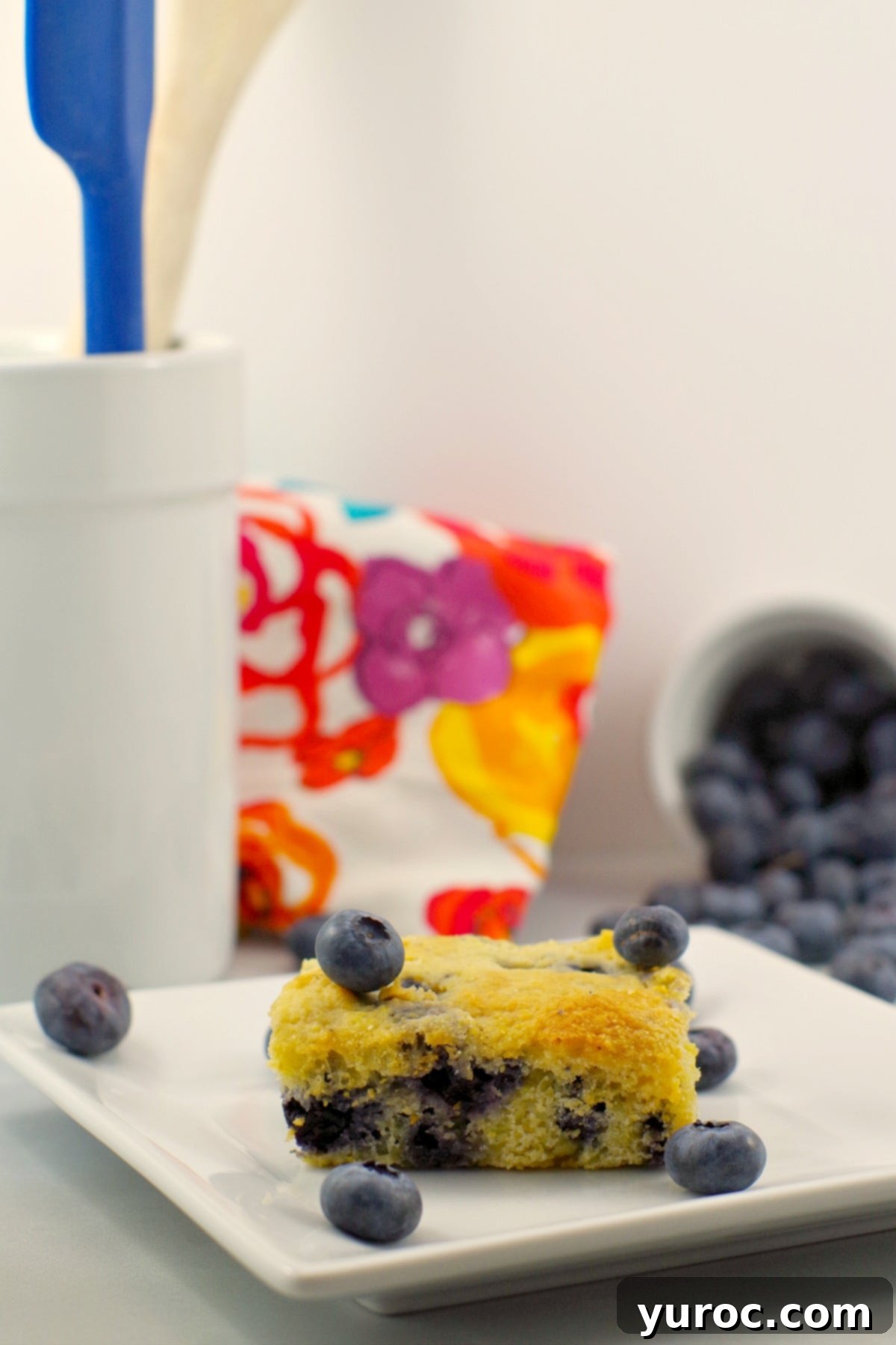 Wholesome Blueberry Cornbread Delight 14 Close-up of a slice of healthy blueberry cornbread, showing the moist texture and evenly distributed blueberries.