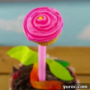 Sweet Seedlings 16 Flower pot cupcake on wooden surface with blue sky background