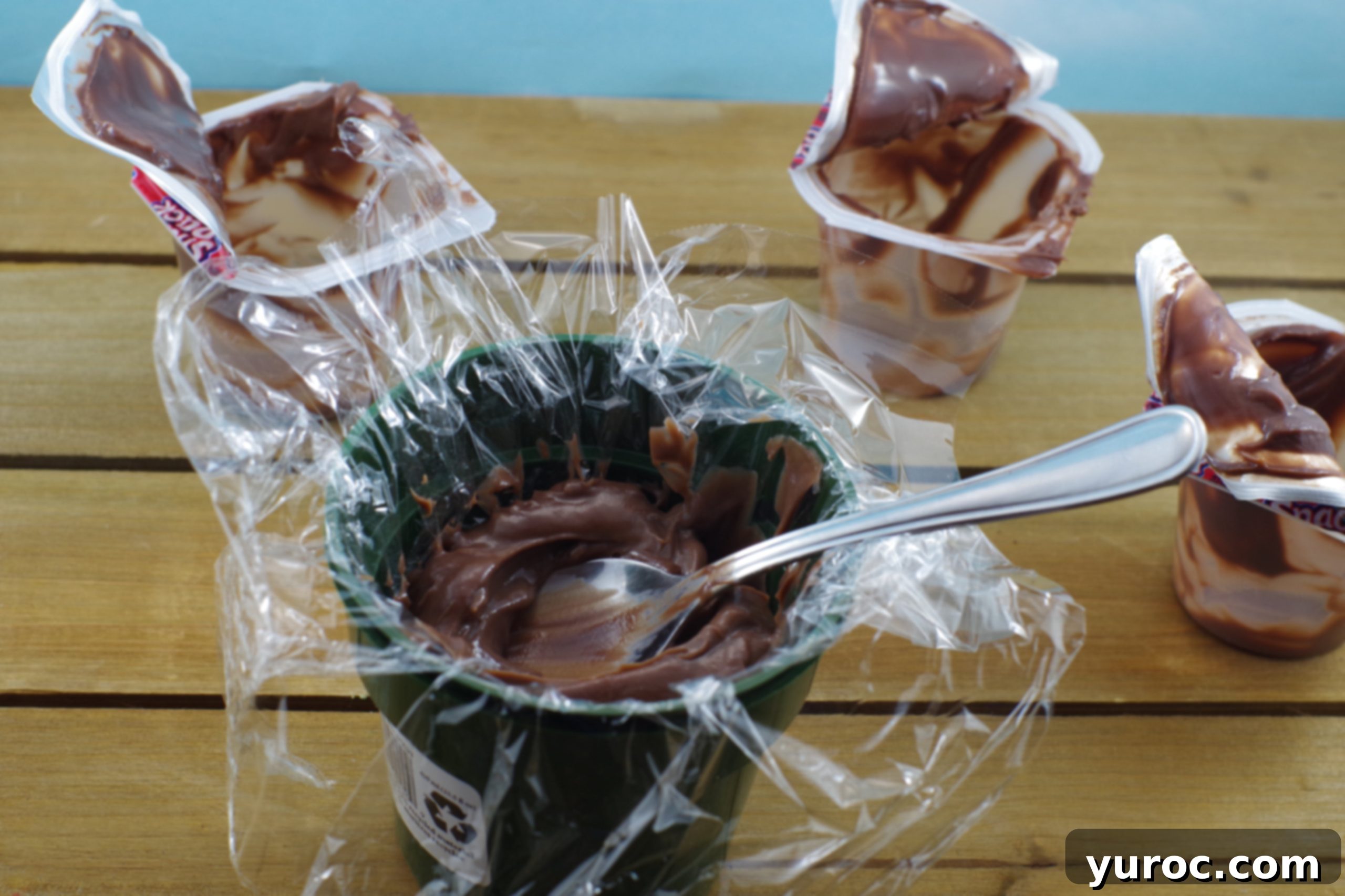 Sweet Seedlings 5 Chocolate pudding being poured into a plastic-lined flower pot.