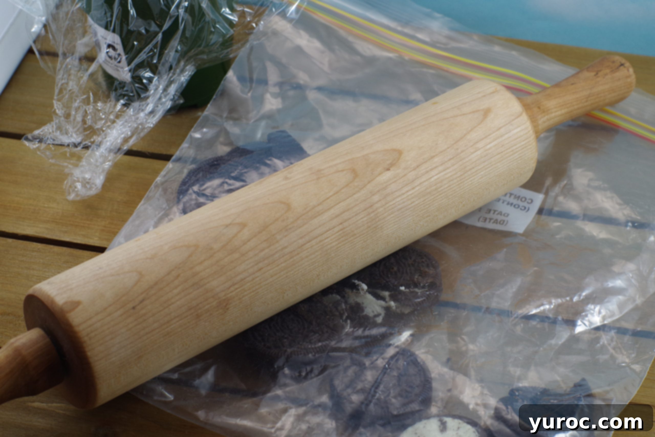 Sweet Seedlings 6 A rolling pin crushing Oreo cookies in a Ziplock bag for cupcake dirt.