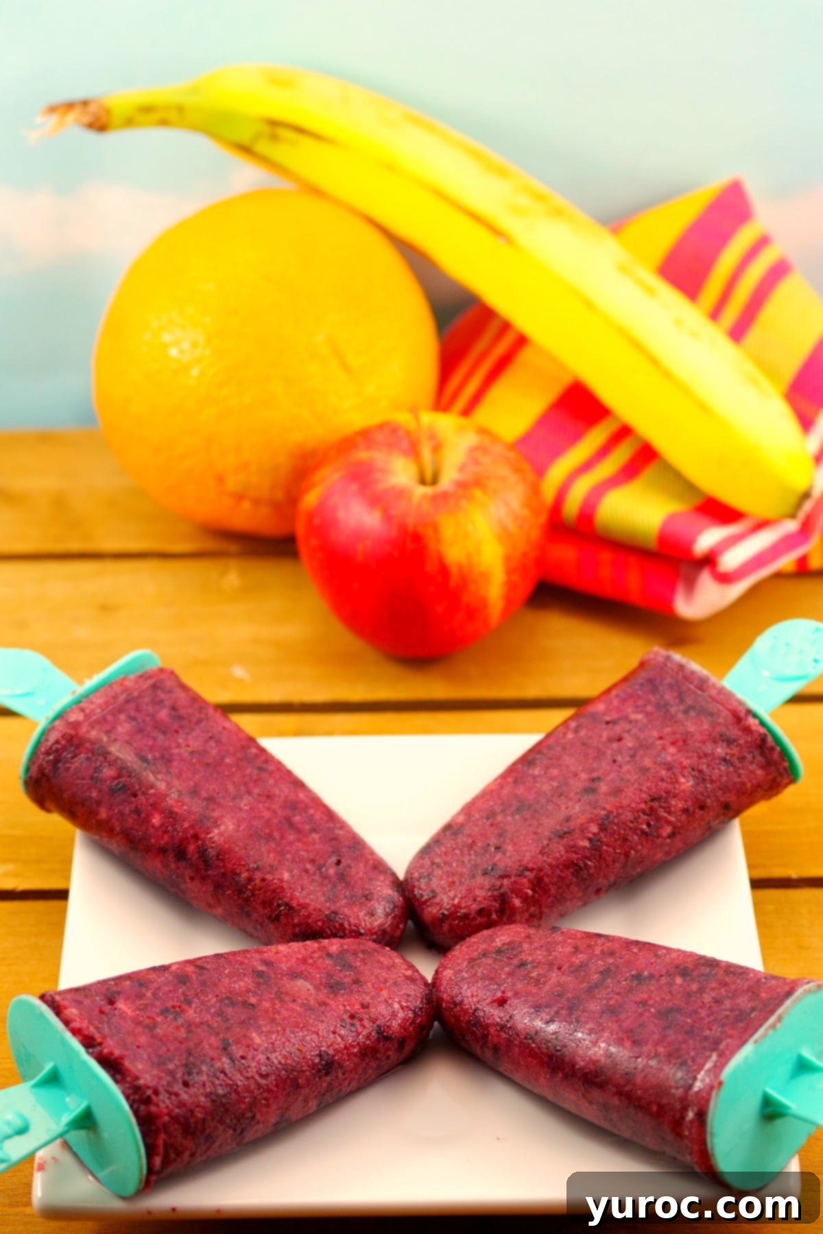 Six delicious Pure Fruit Popsicles, sugar-free and made with zero food waste, displayed attractively. - foodmeanderings.com