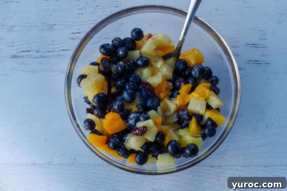 Sun-Kissed Peach Pineapple Salsa 3 Peach pineapple salsa ingredients in a medium glass bowl.