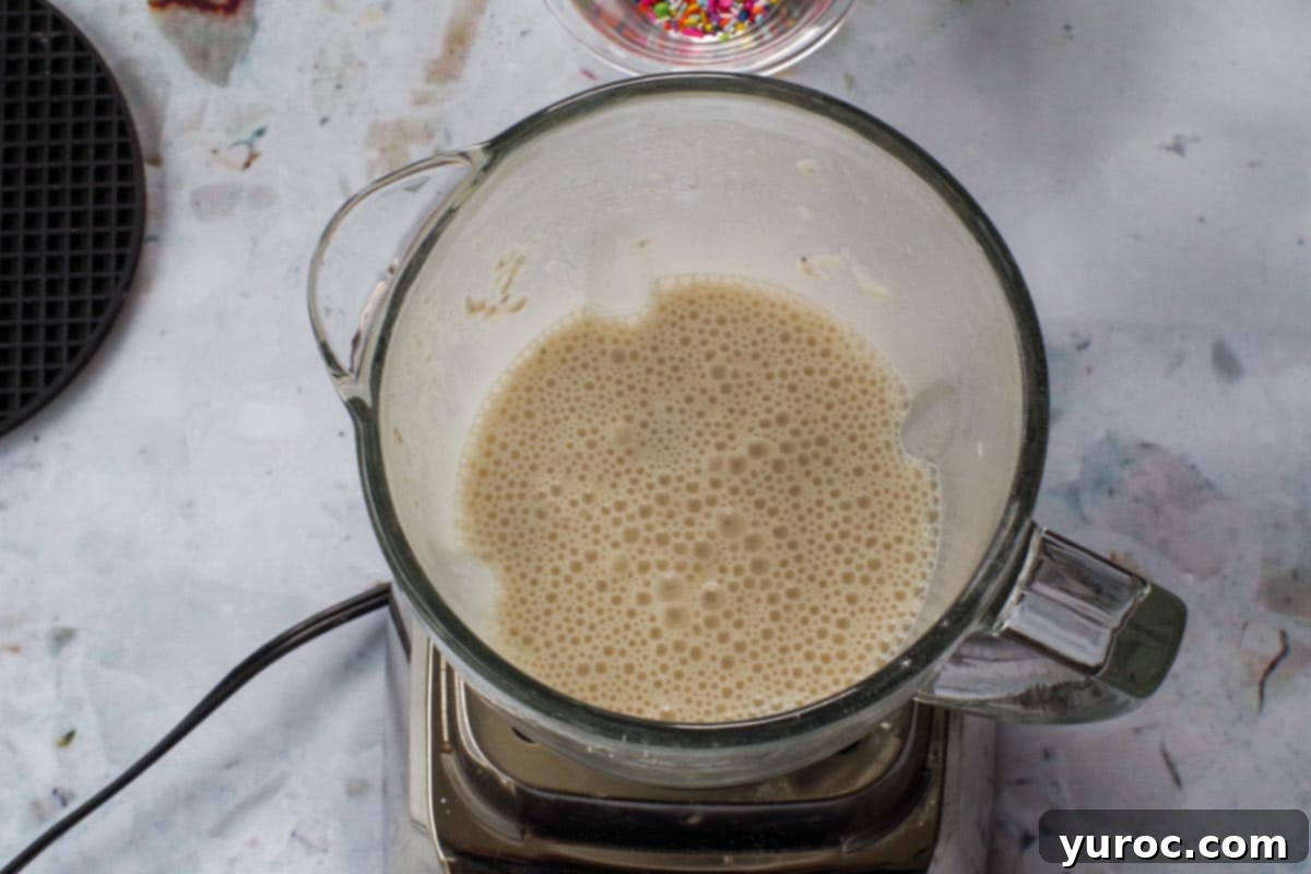 Blended birthday cake crepe batter in a blender.