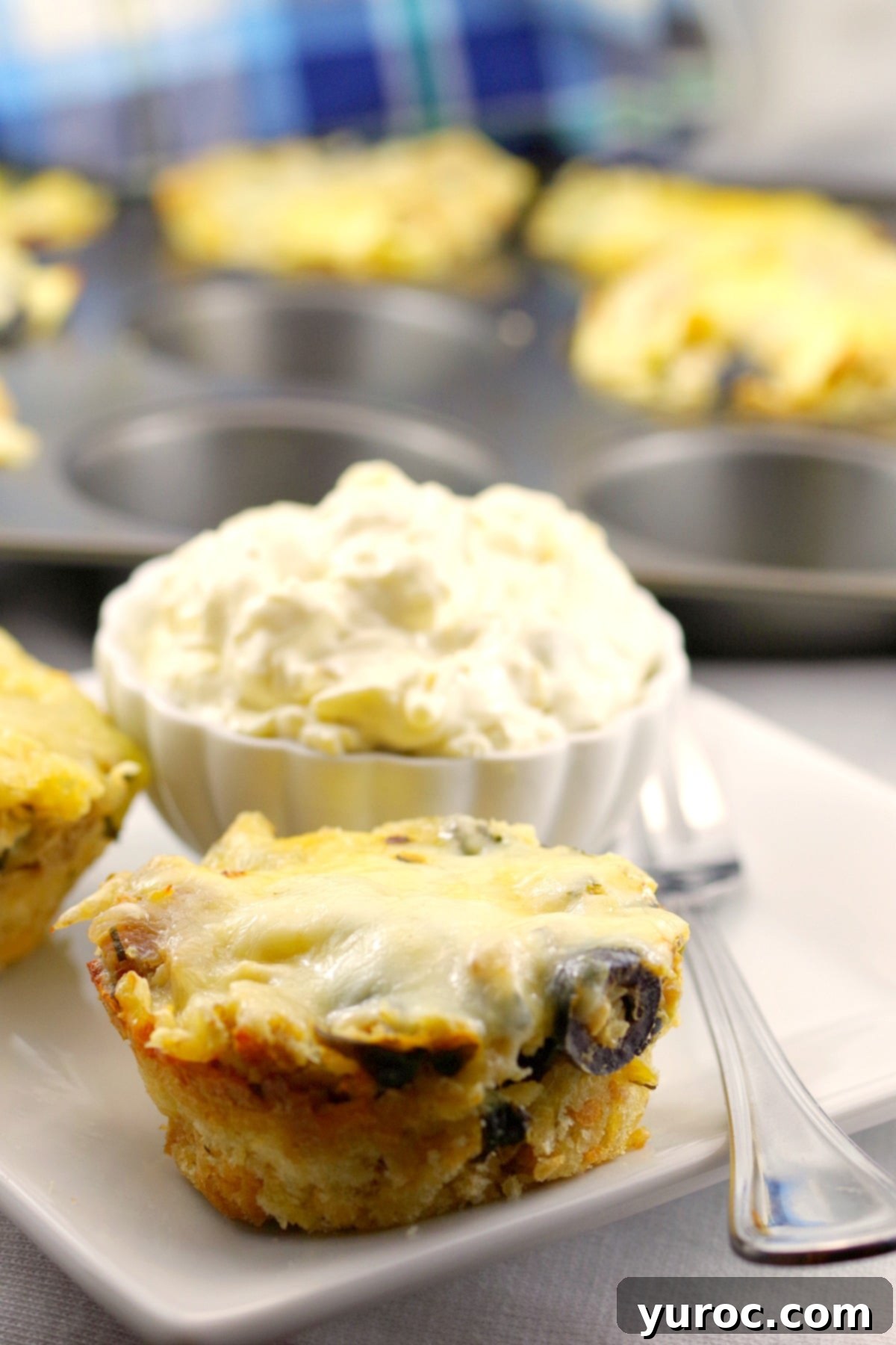 Grecian Baked Pasta Bites 4 Greek Lasagna cups recipe - process of pressing garlic toast crumbs into a muffin tin
