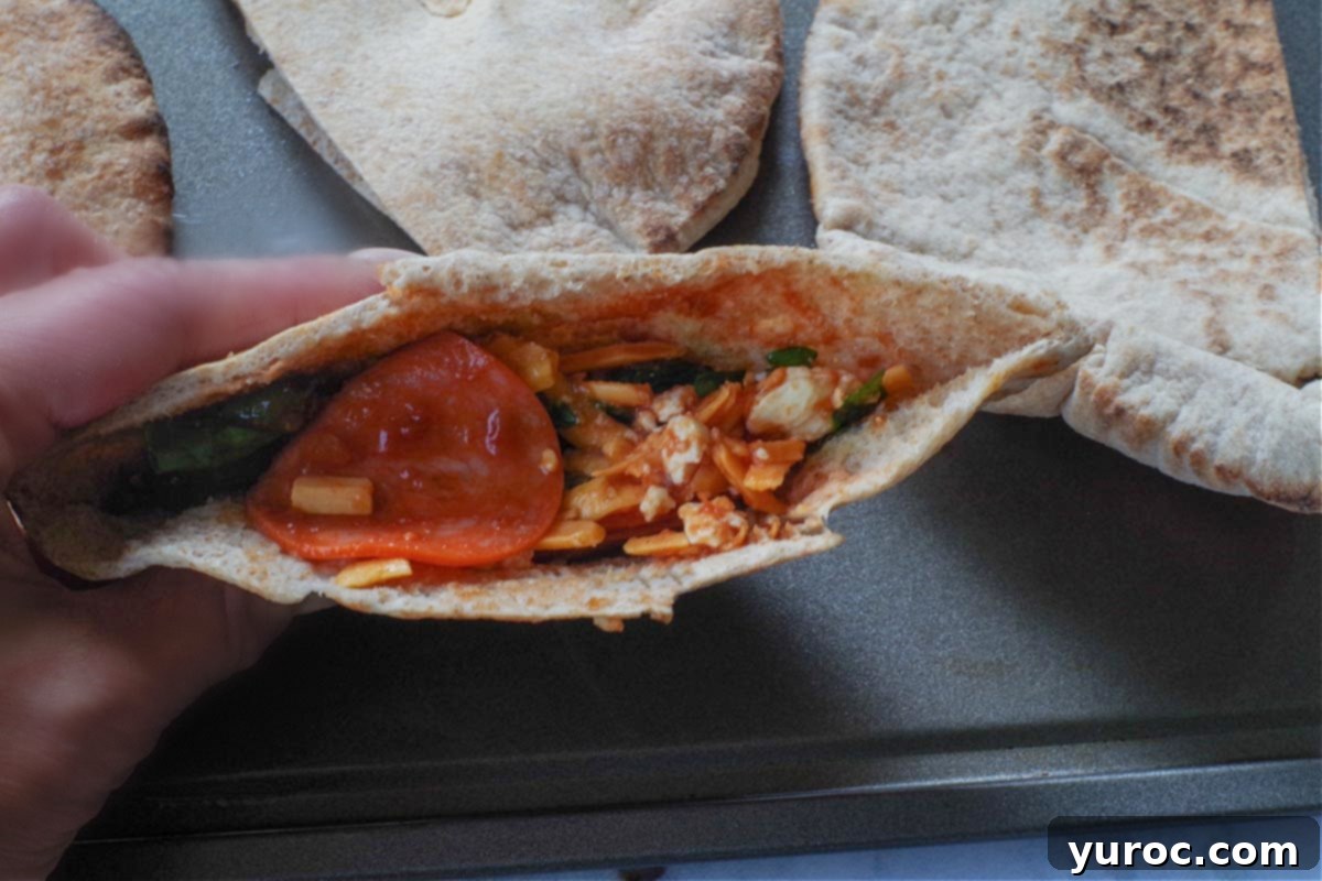 Wholesome Pita Pizza Pouches 9 A pita half filled with a generous amount of delicious pizza filling.