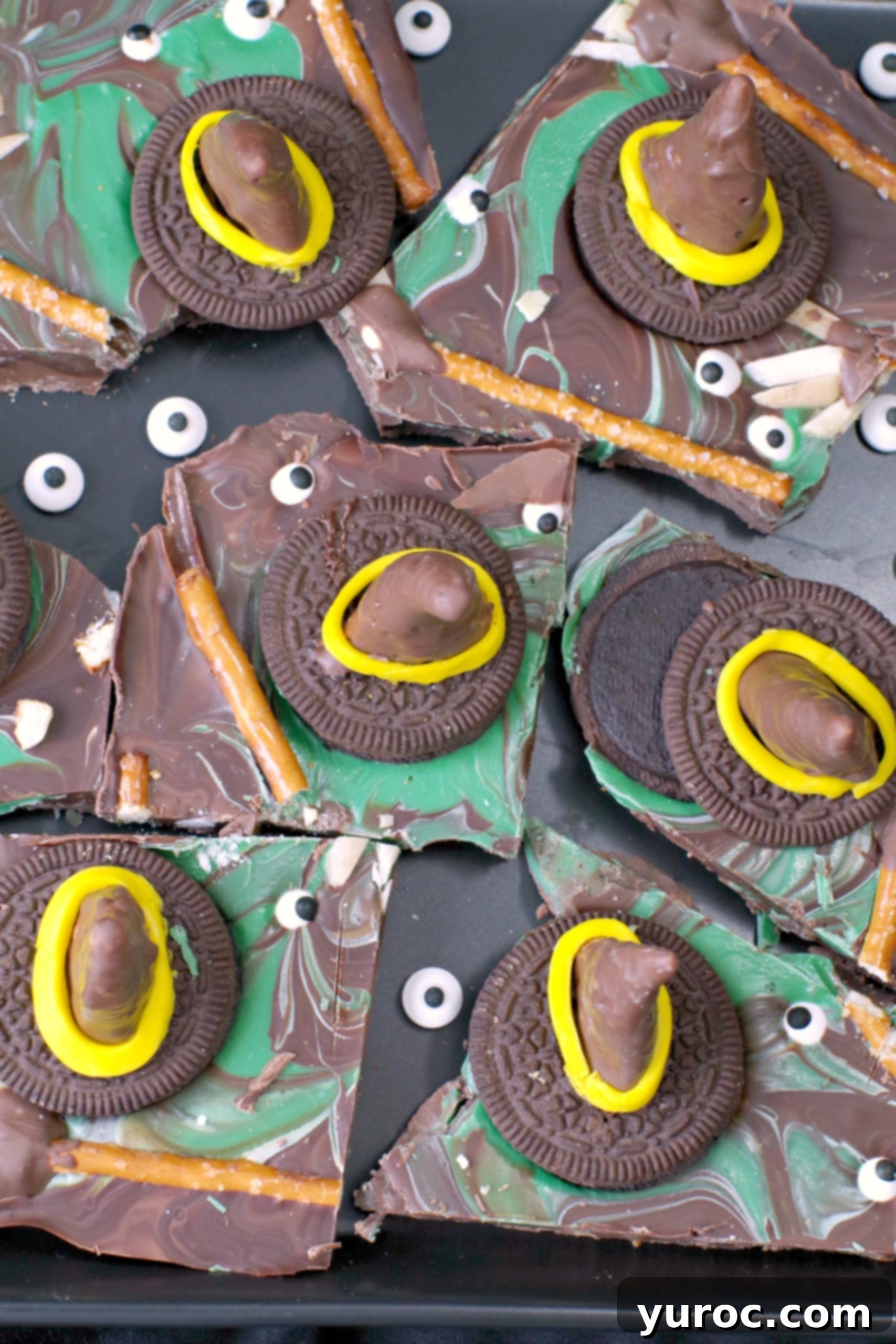 Bewitching Melted Witch Bark Bites 5 Melting Witch Halloween Chocolate Bark broken into pieces on black platter with extra candy eyes scattered on plate