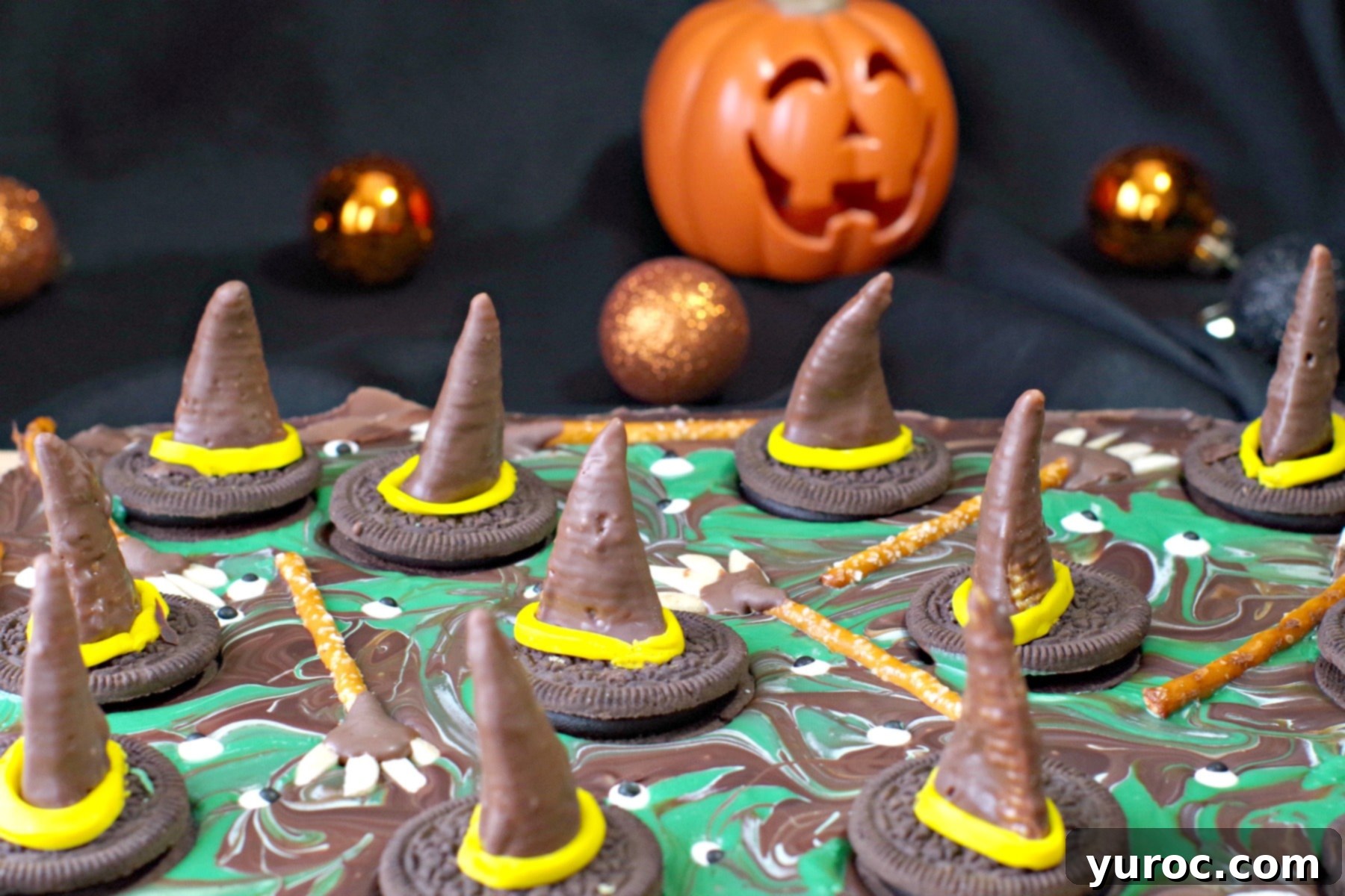 Bewitching Melted Witch Bark Bites 7 melting witches chocolate Halloween bark with plastic pumpkin in the background