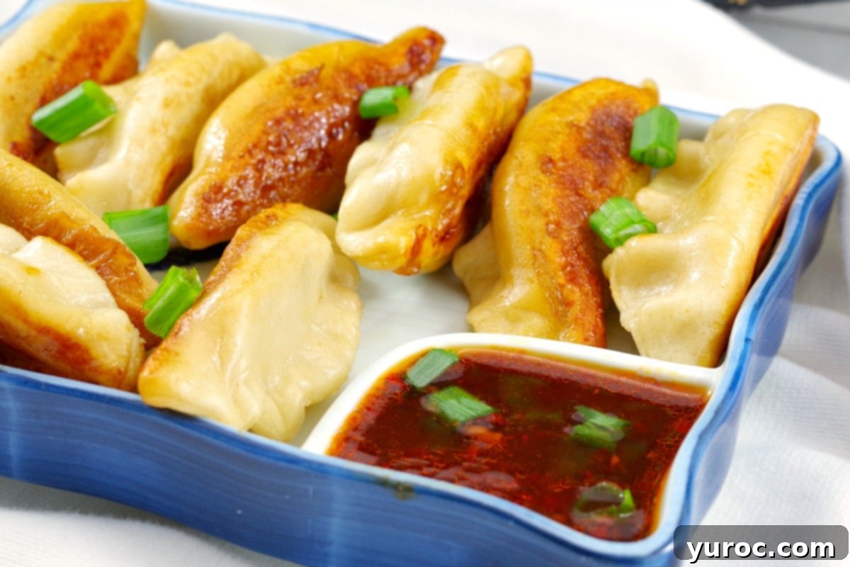 Beautifully pleated Wor Tip Potsticker Dumplings ready for cooking