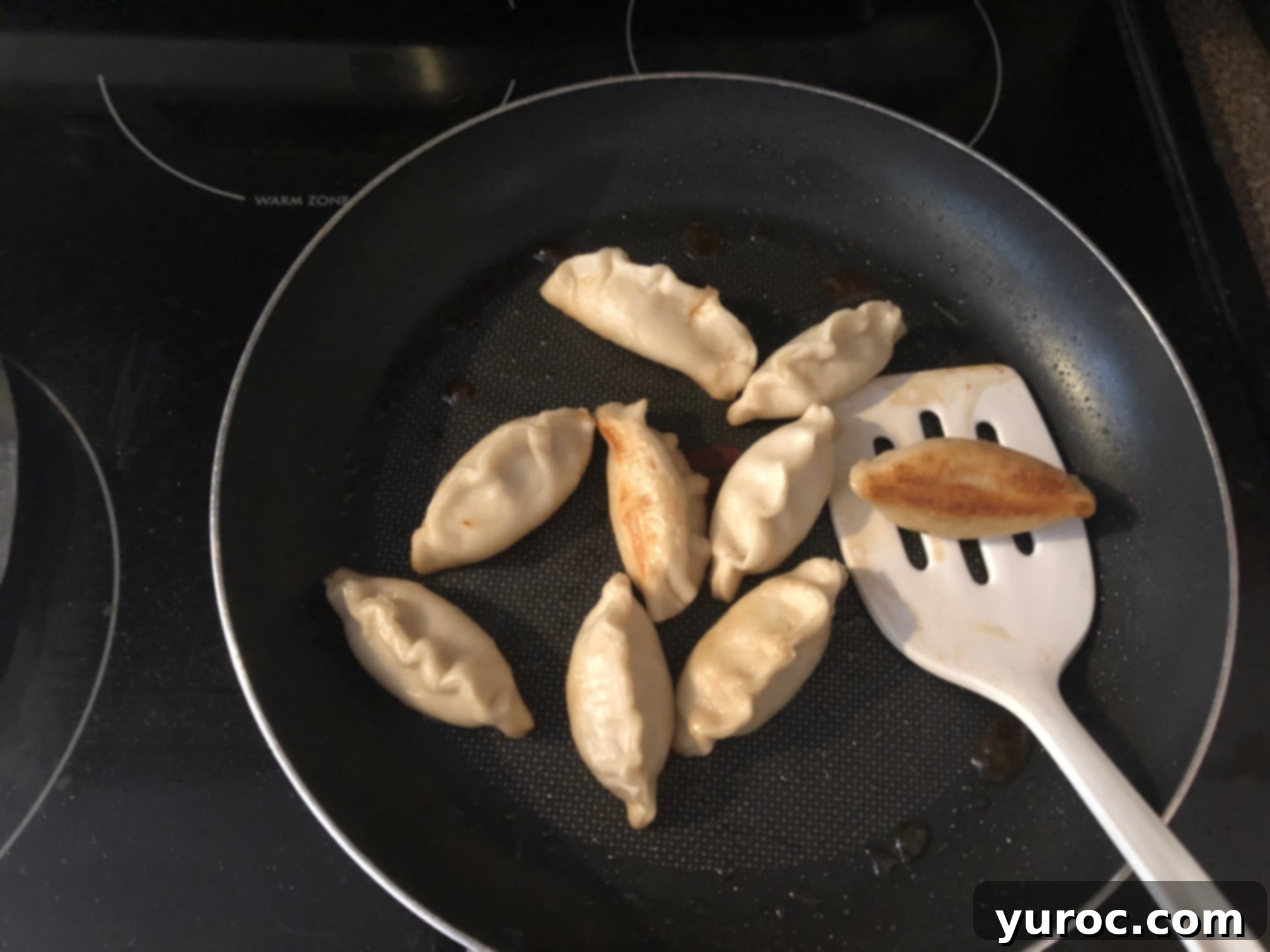 Pan-frying Chinese Potstickers to achieve a crispy brown bottom