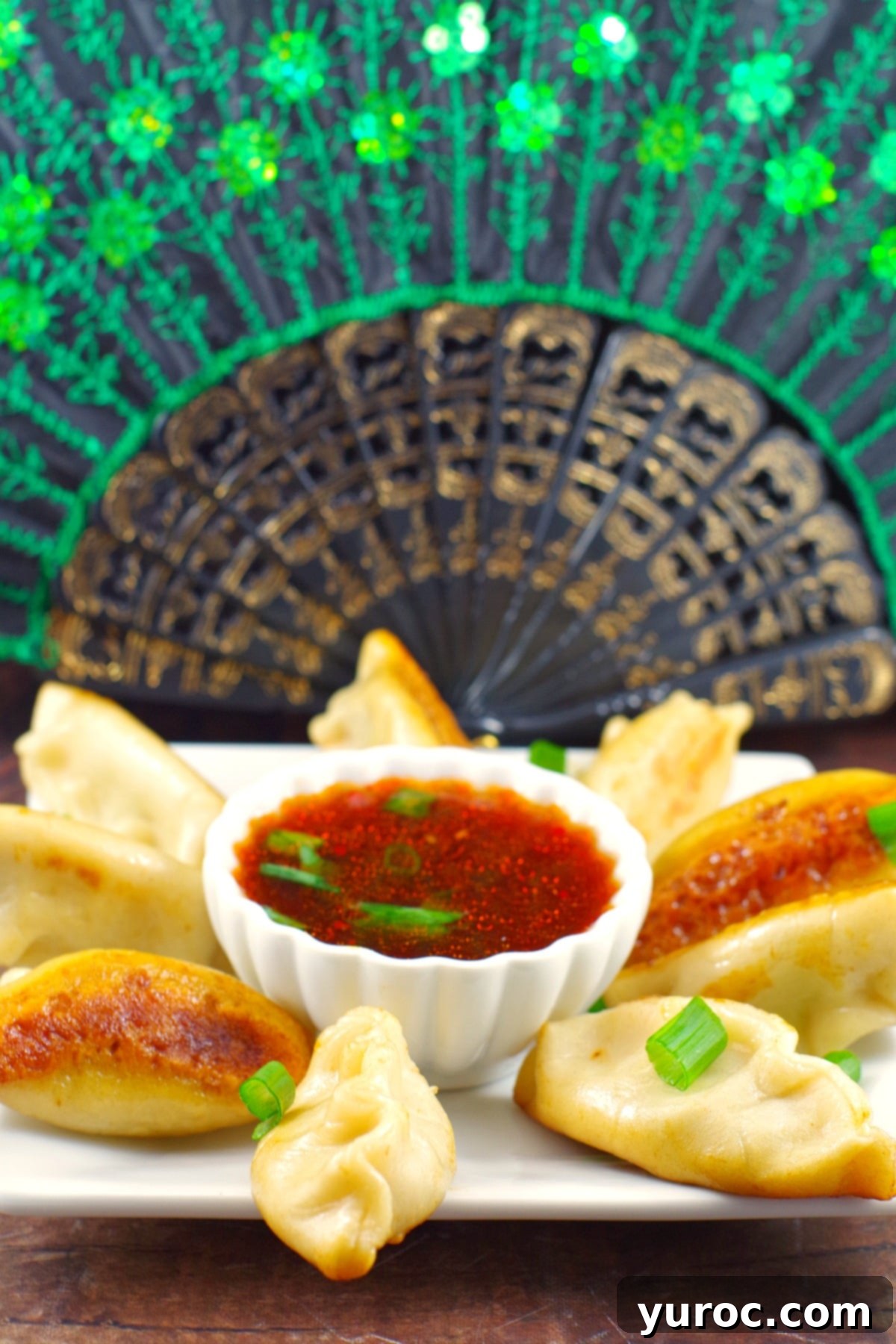 Pile of crispy homemade Chinese Potsticker Dumplings on a plate