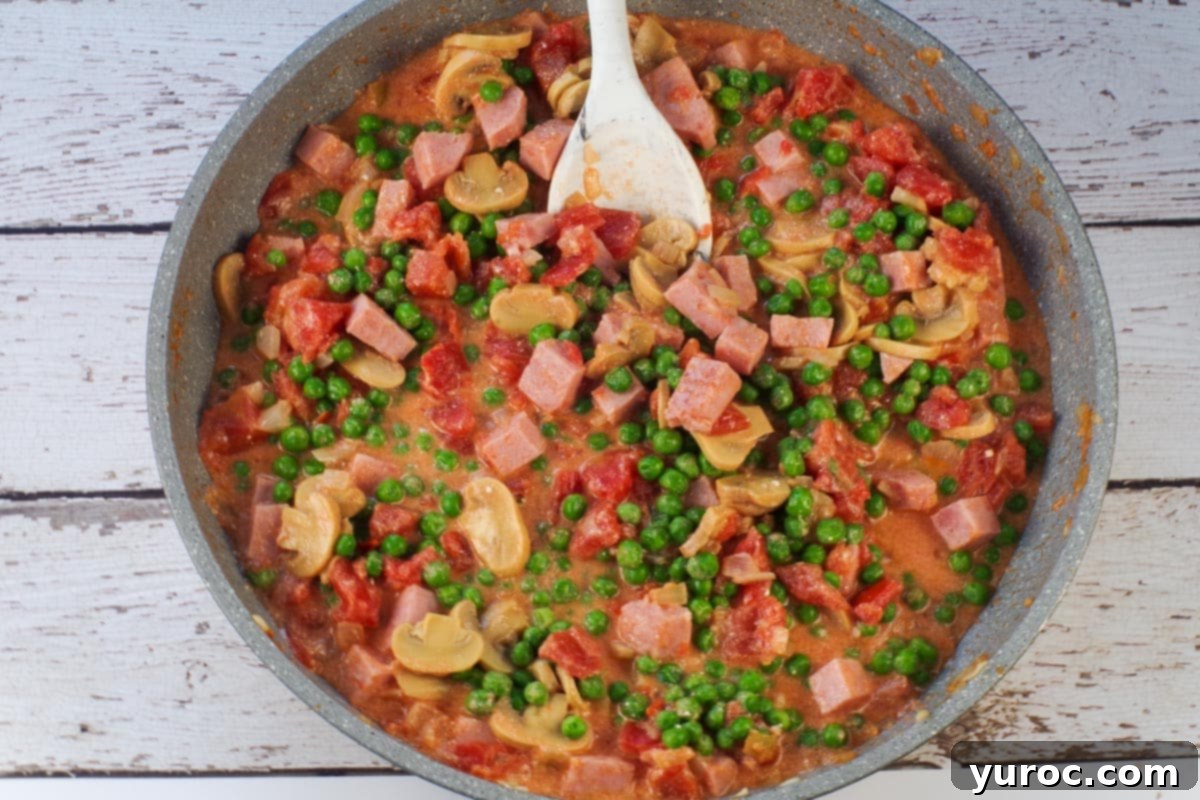 peas and mushrooms added to ham mixture