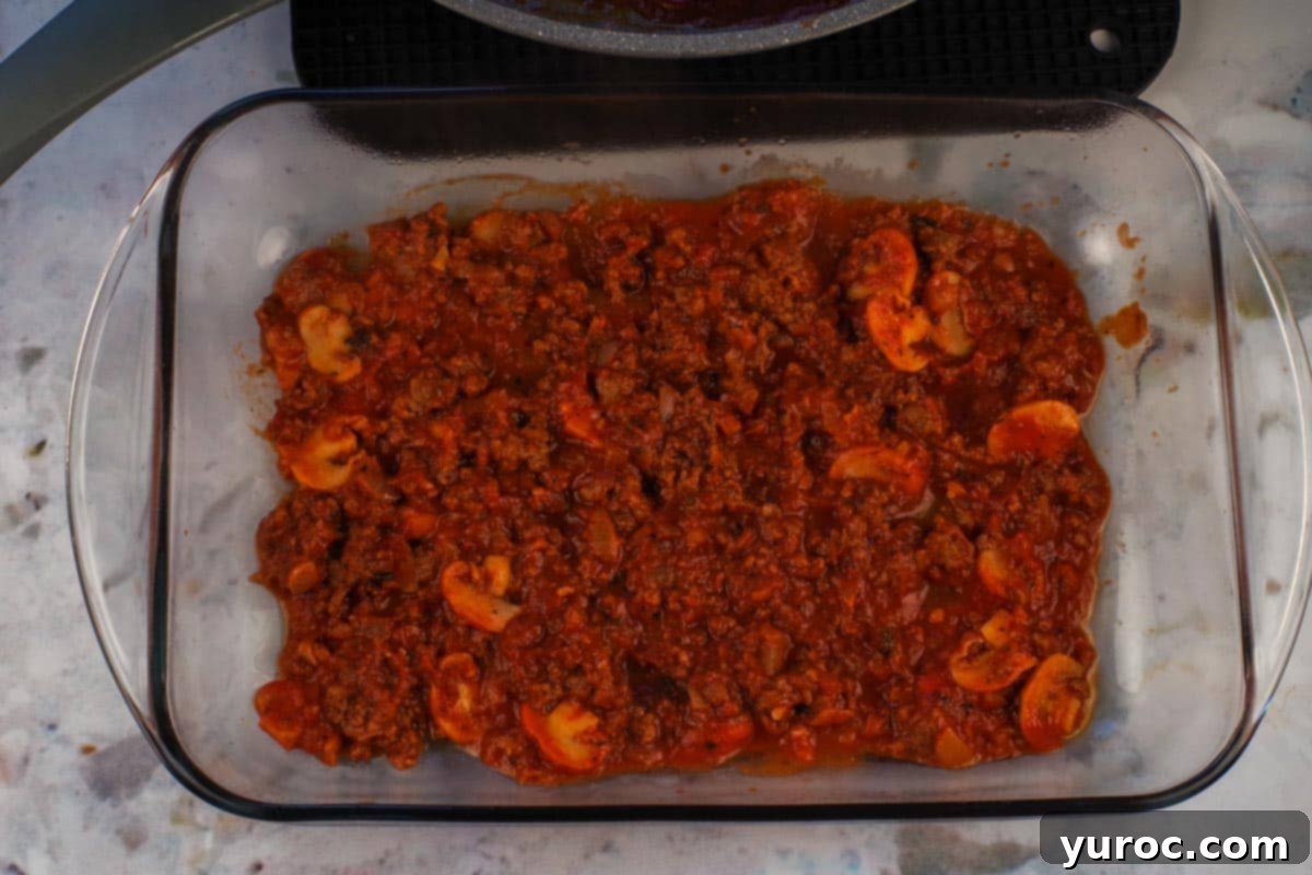 Prep-Ahead No-Boil Lasagna 6 First layer of meat sauce spread evenly on the bottom of a glass lasagna pan