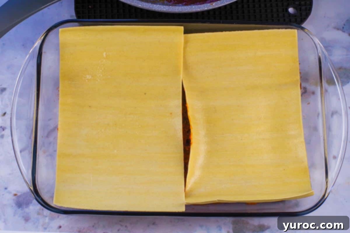 Prep-Ahead No-Boil Lasagna 7 Fresh lasagna sheets laid over the first layer of meat sauce