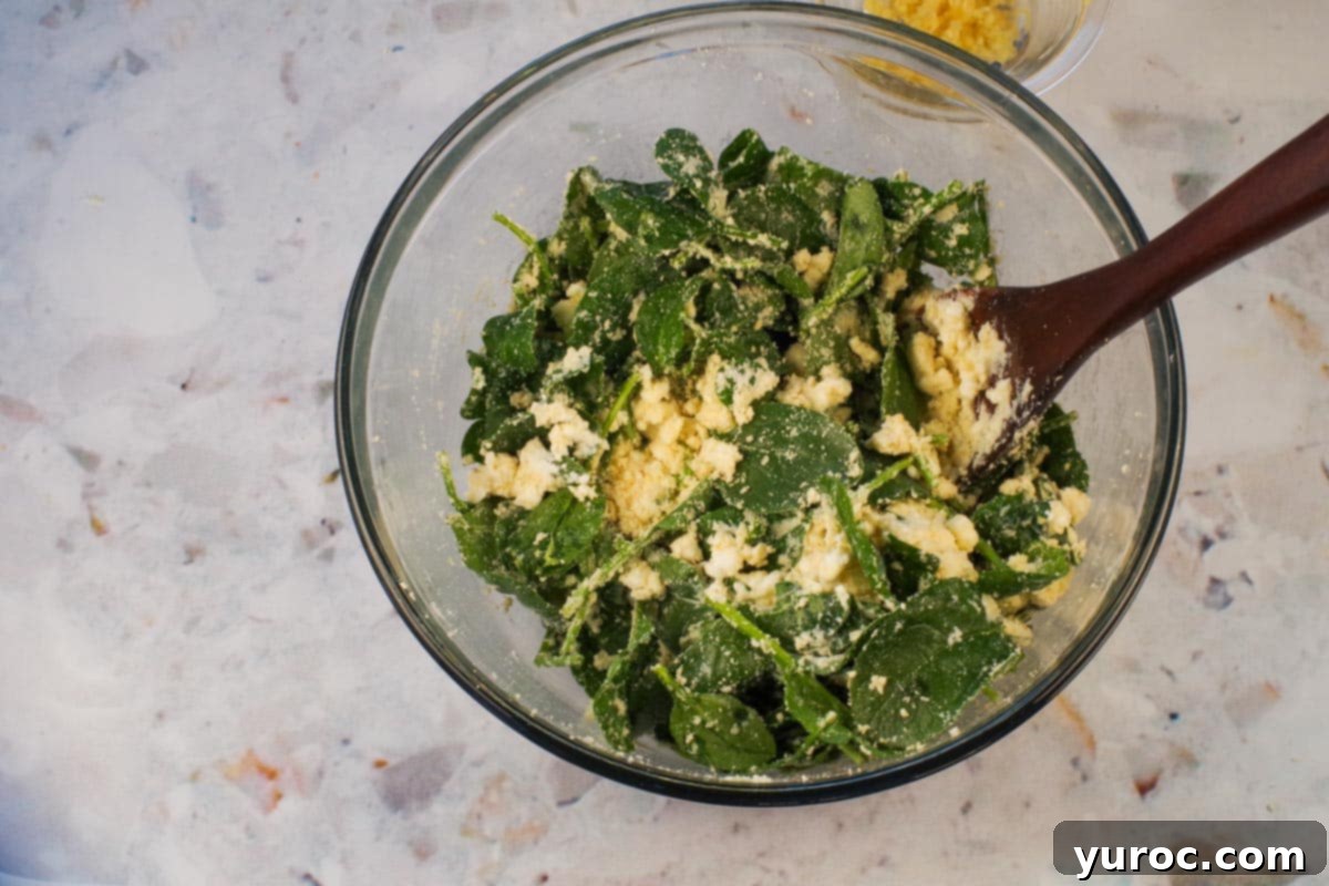 Prep-Ahead No-Boil Lasagna 8 Fresh spinach, cottage cheese, and Parmesan cheese mixed together in a glass bowl