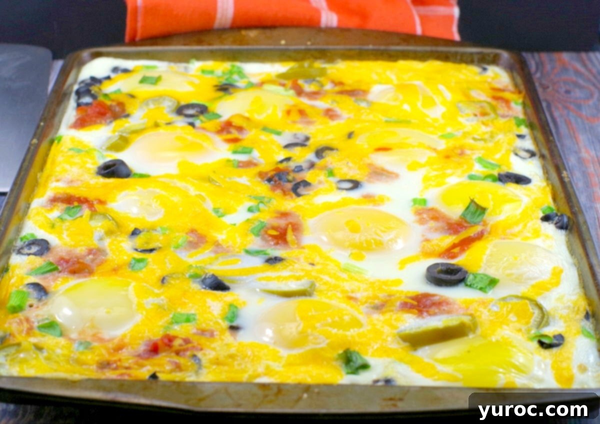One-Pan Mexican Fried Eggs 3 Close-up of Mexican Sheet Pan Eggs with melted cheese and toppings