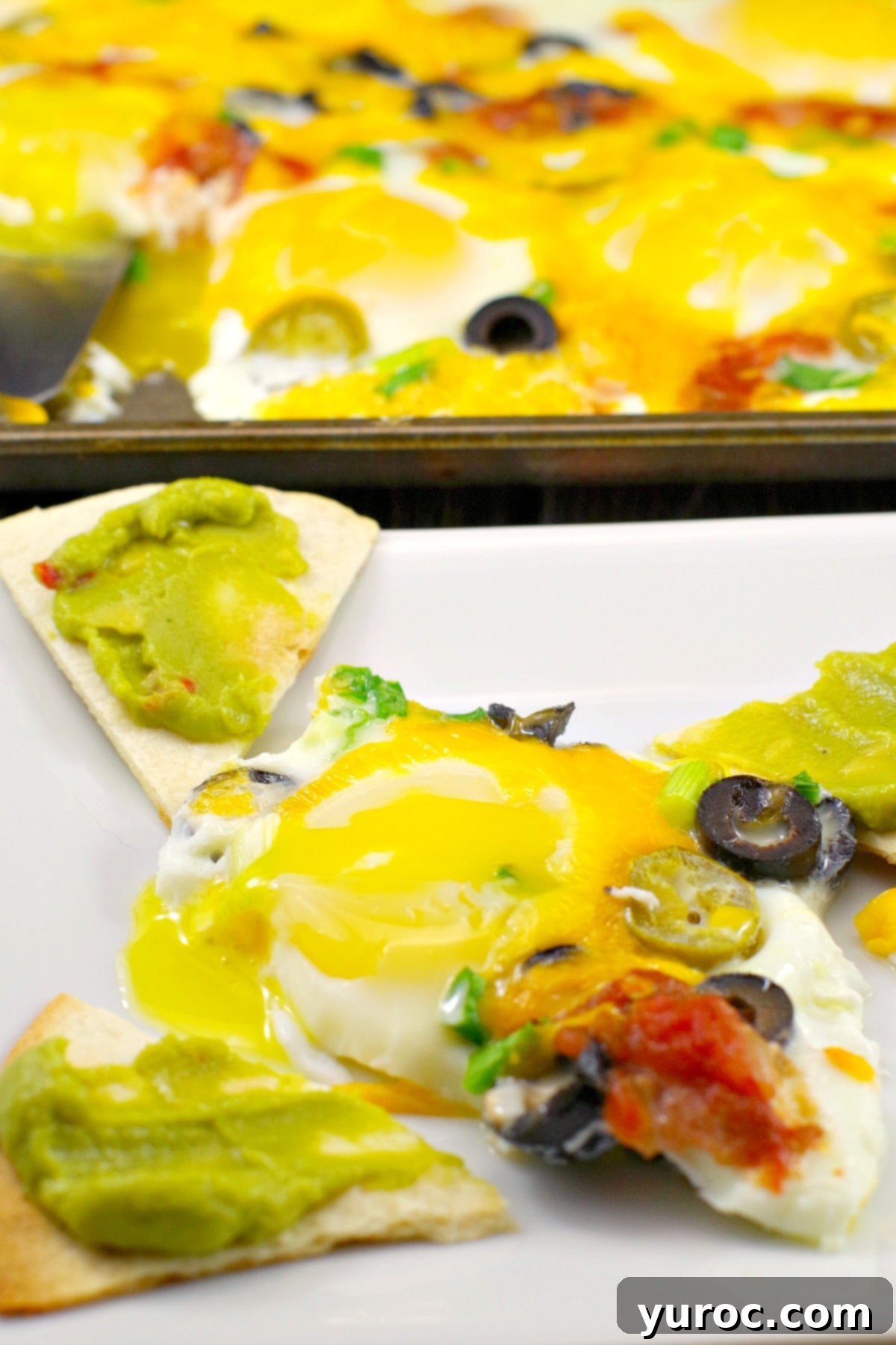 One-Pan Mexican Fried Eggs 4 Single serving of Mexican sheet pan eggs with avocado slices