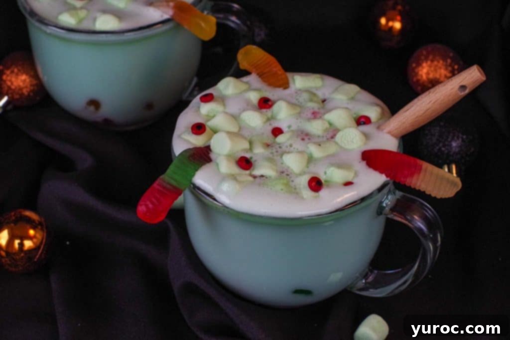 Witch's Meltdown Halloween Punch 5 Halloween hot chocolate in a clear mug with a black background