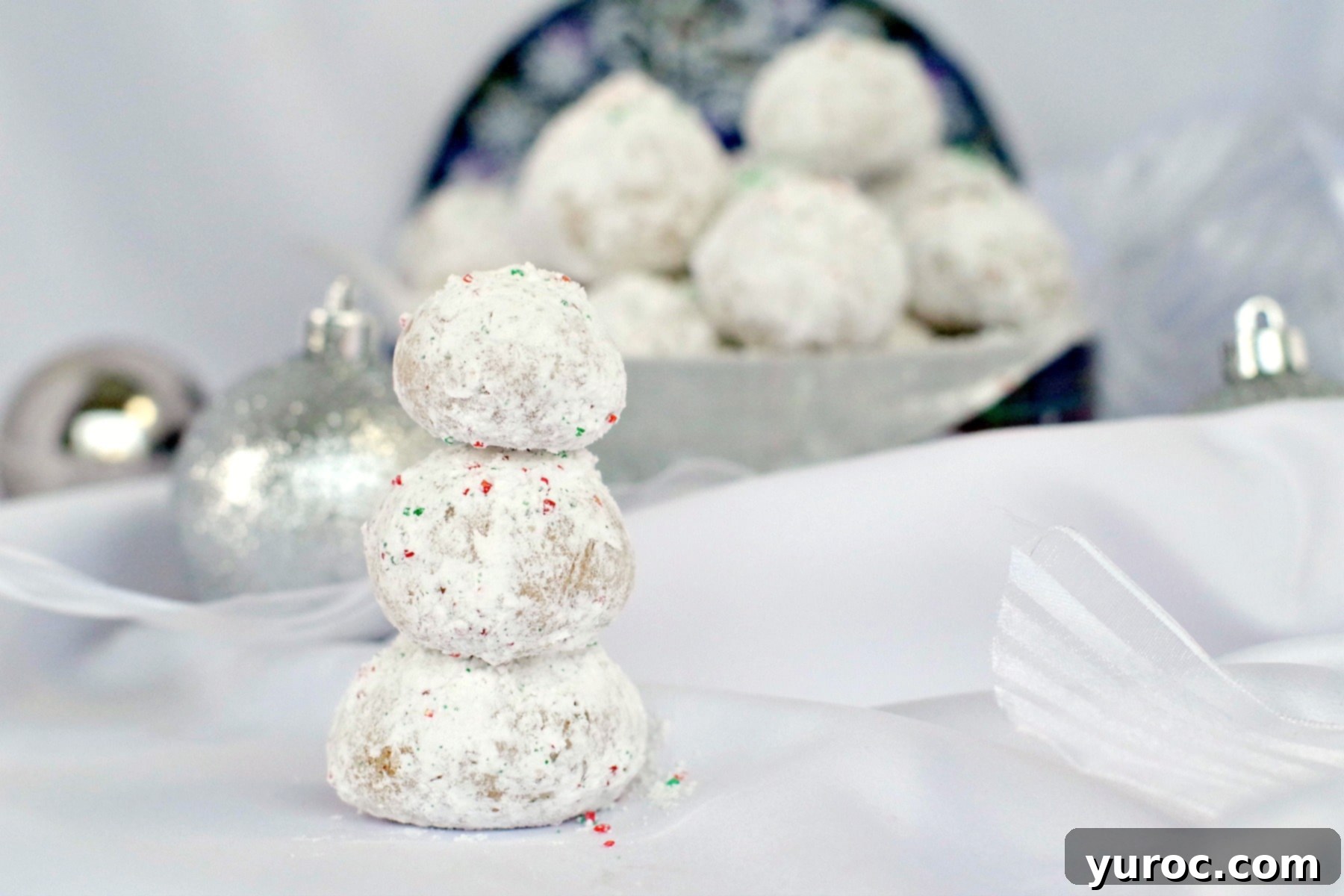 Winter Spice Almond Snow Puffs 4 Gingerbread Snowball Cookies piled up to look like a snowman