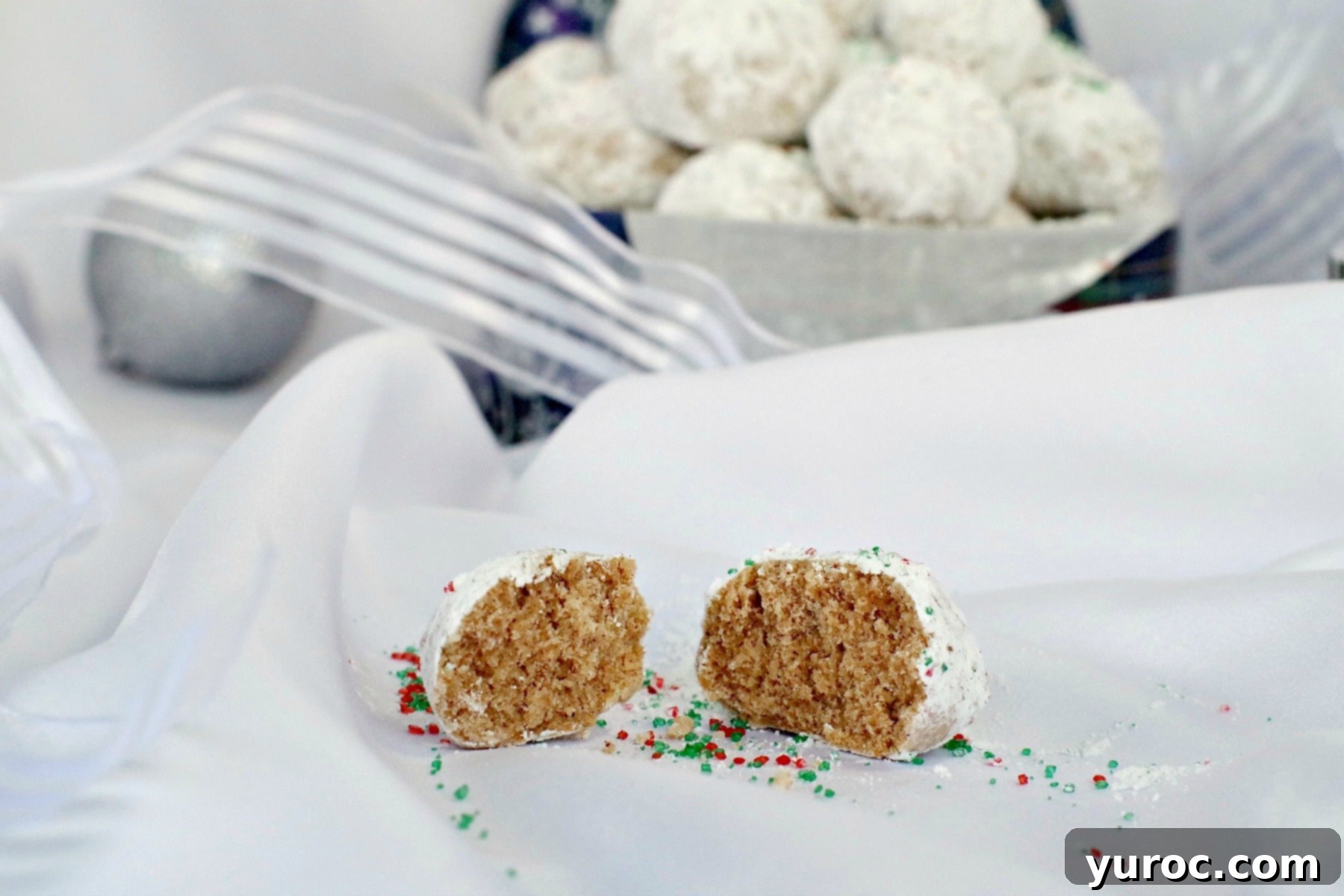 Winter Spice Almond Snow Puffs 5 Gingerbread Snowball cookies broken in half, showing their tender interior