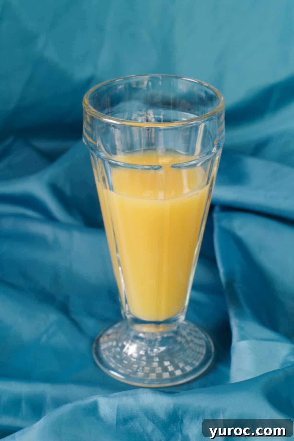 Shirley Temple Mocktail Recipe 5 Step 2: 1 part orange juice added to the glass
