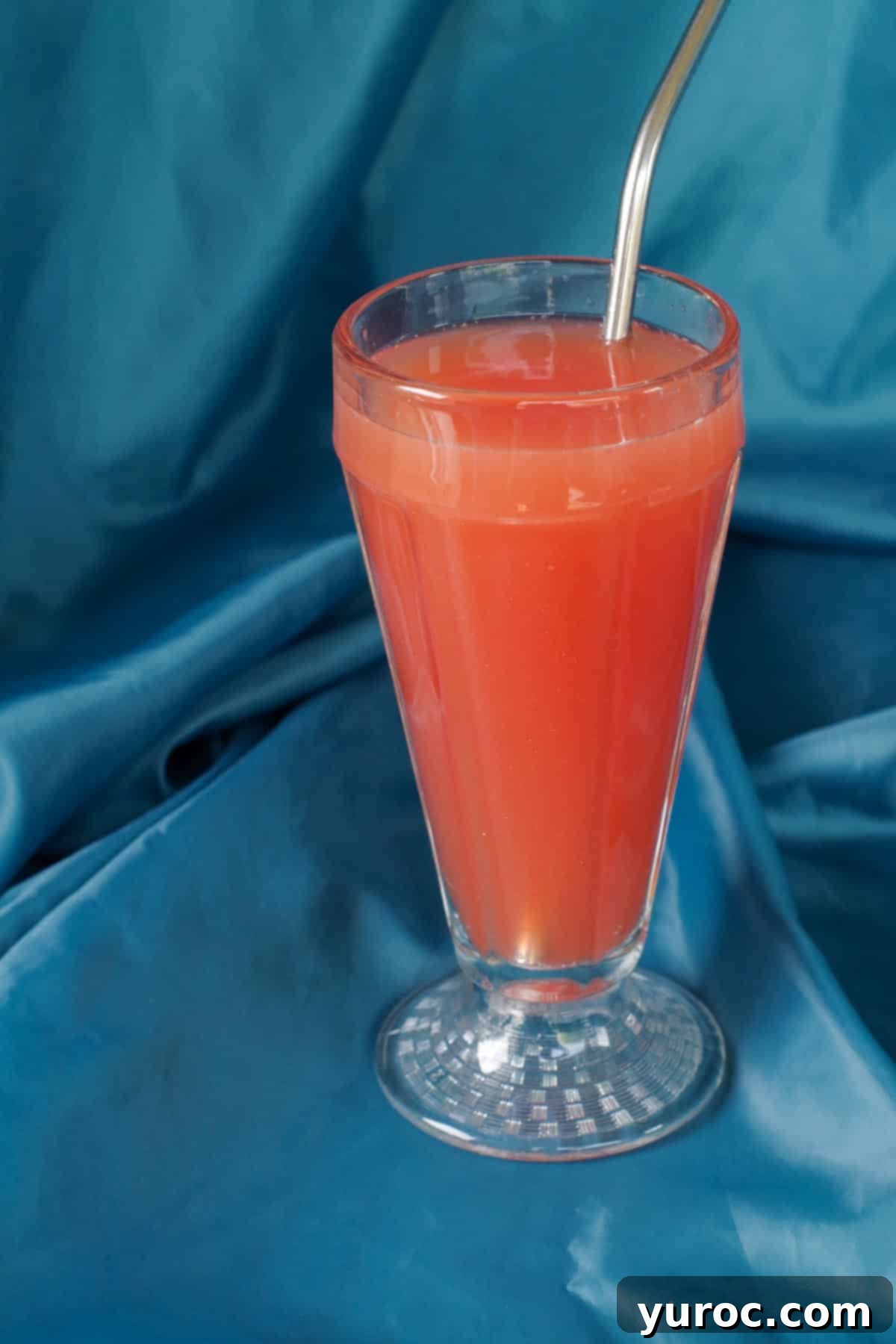 Shirley Temple Mocktail Recipe 7 Step 4: Grenadine added to glass and stirred with a straw, showing the final mix.