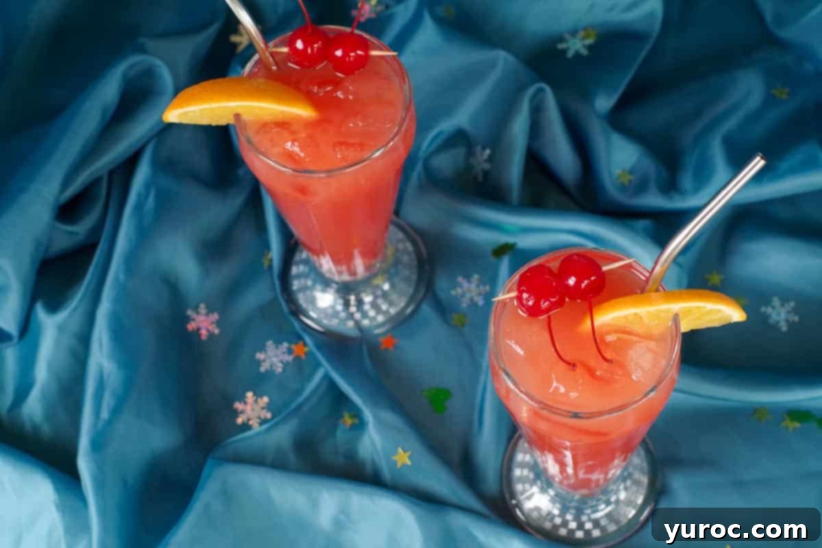 Shirley Temple Mocktail Recipe 8 Two glasses of Shirley Temple drinks photographed from above, highlighting their vibrant color and garnishes.