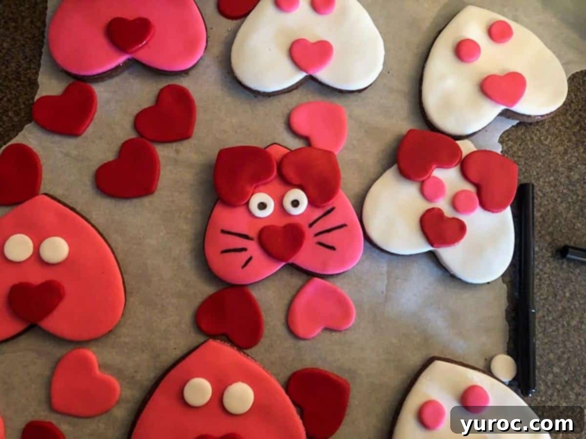 Purr-fect Heart-Shaped Cat Treats 6 Heart-shaped cat cookies with some done (with whiskers etc)