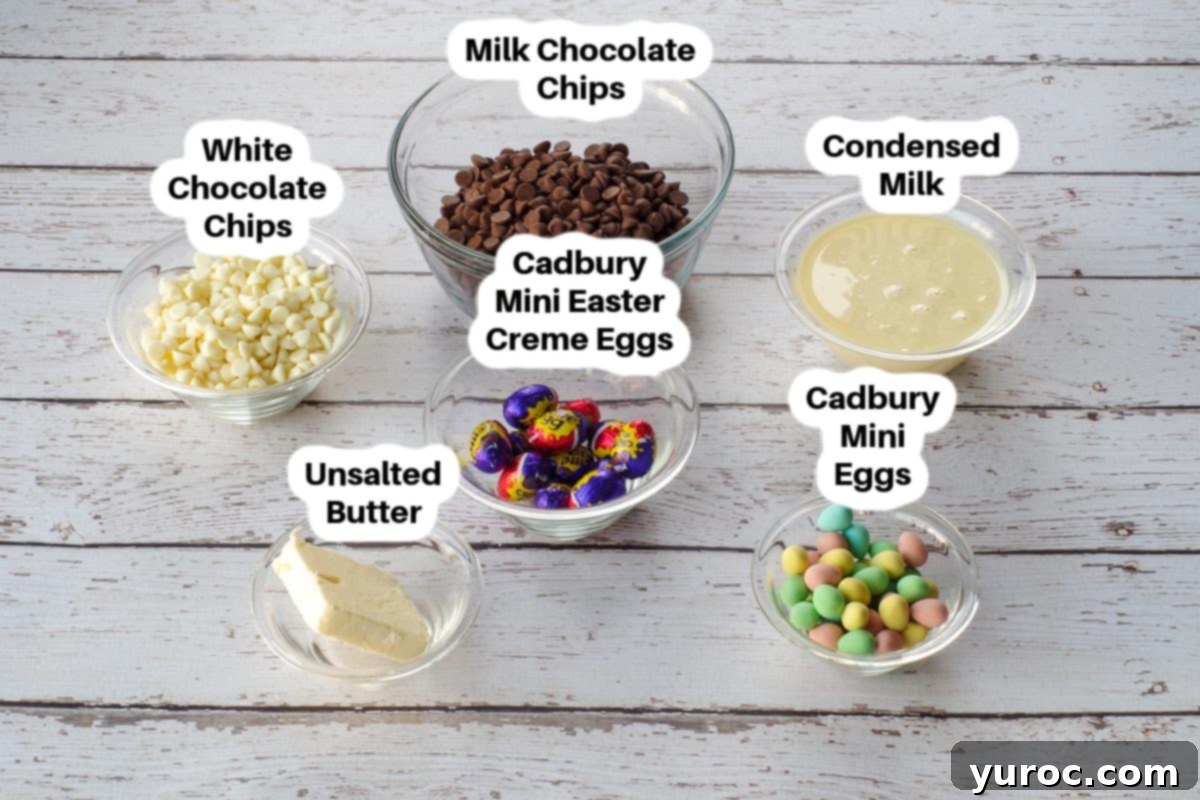 Various ingredients for Easter Creme Egg Fudge laid out in glass bowls, clearly labelled for ease of identification.