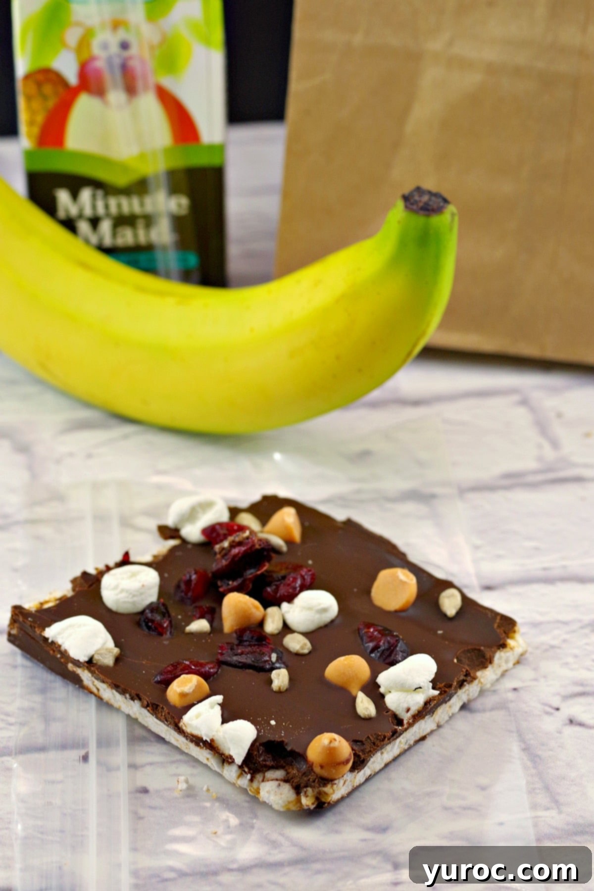 A stack of Healthy No Bake Chocolate Rocky Road Bars, ready to eat, with hashtags #wwrecipes #healthychocolate
