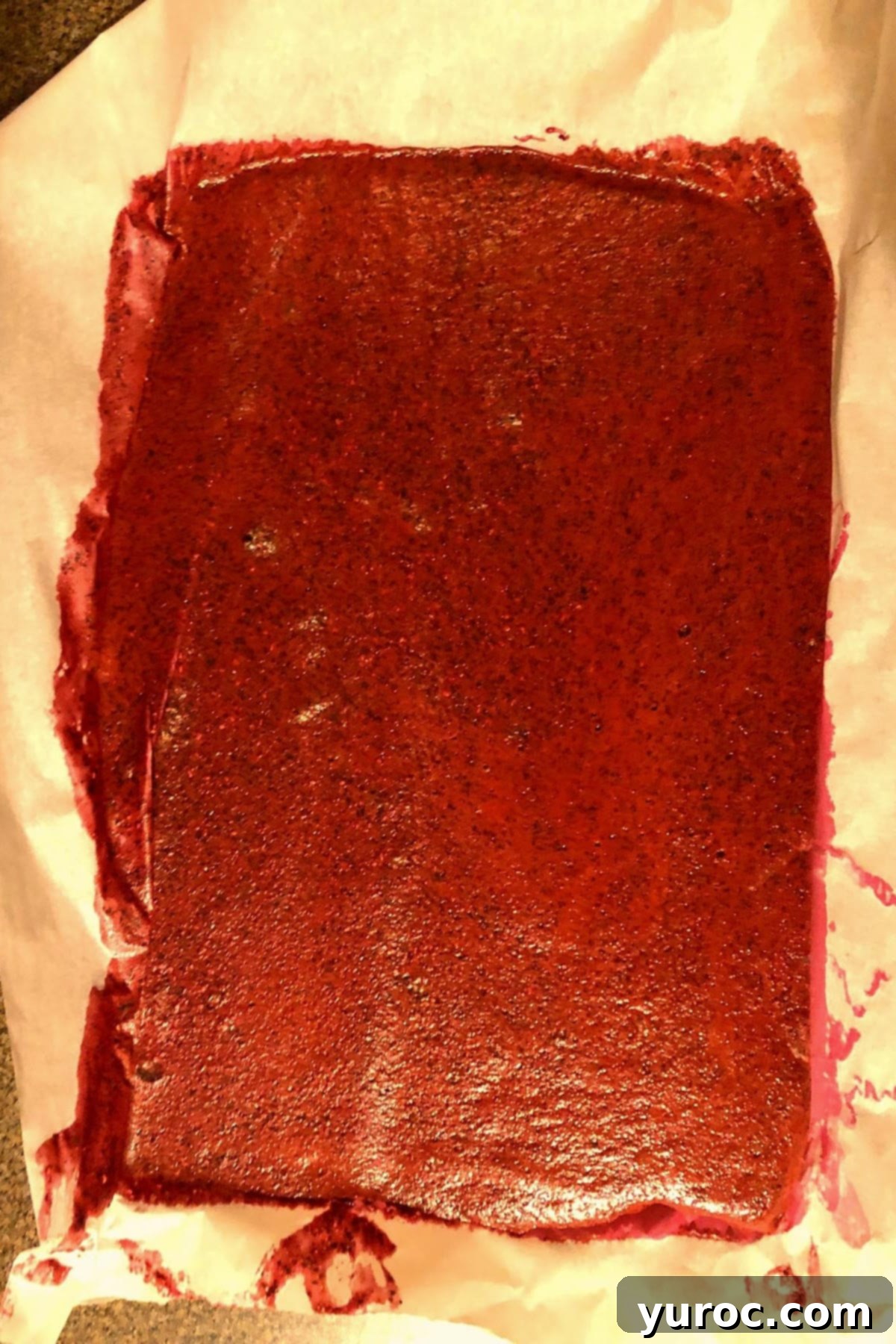 fruit and veg mixture poured onto parchment lined sheet pan