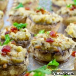 Pierogi Mushroom Bites 8 easy pierogi stuffed mushrooms on a baking sheet covered with foil